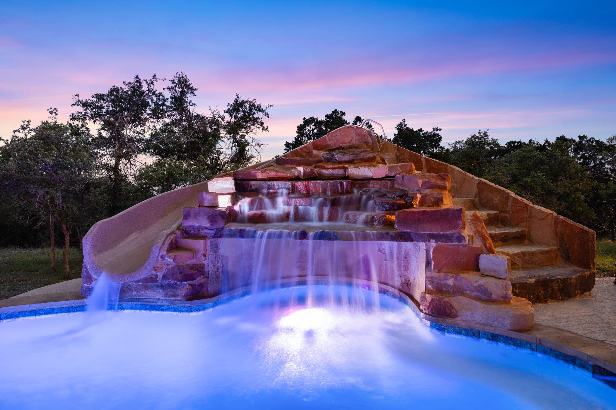 Outdoor living space with pool, kitchen, and pergola