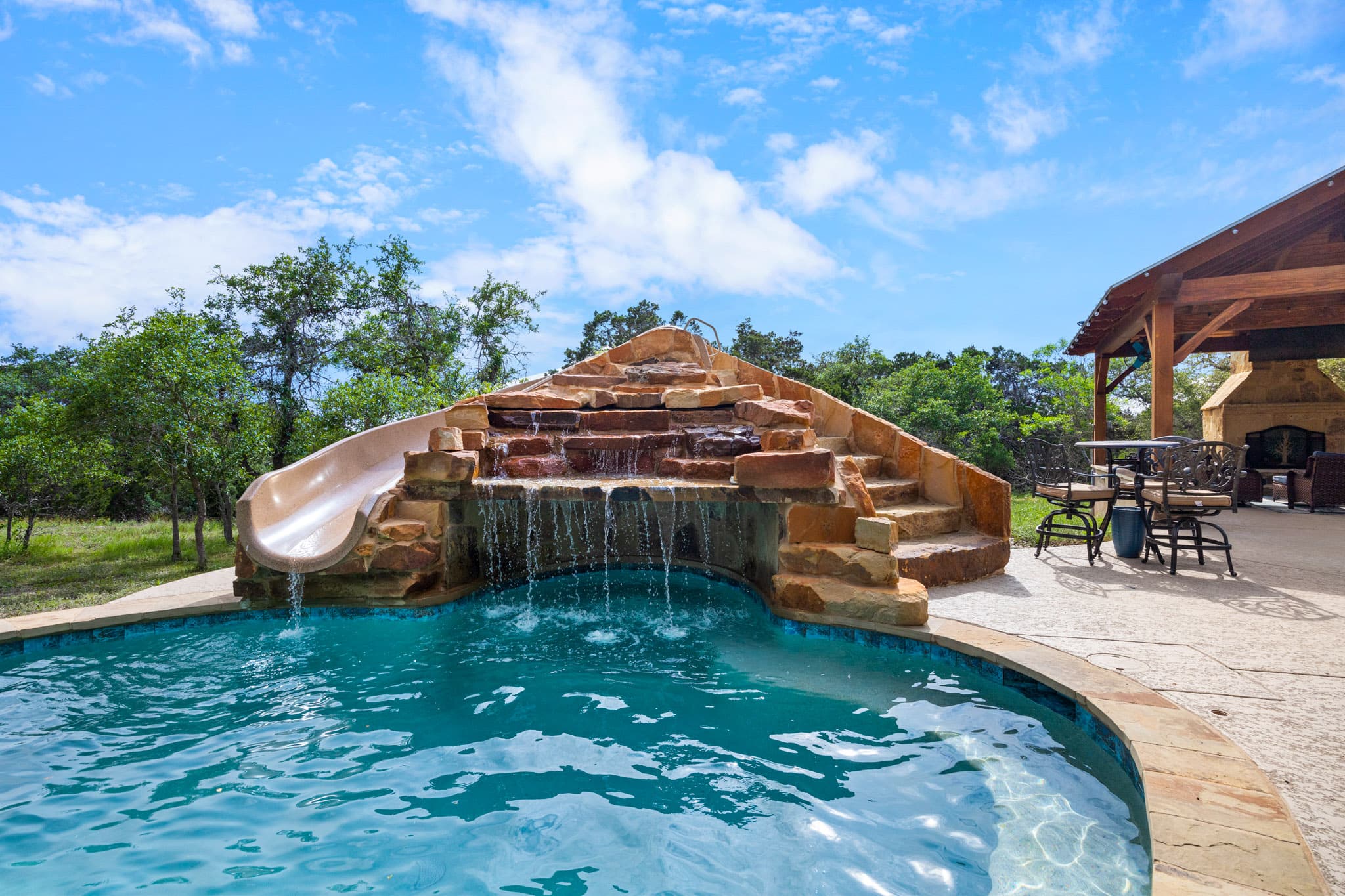 Spring Branch rock grotto pool with waterfall and slide — Spring Branch, Texas