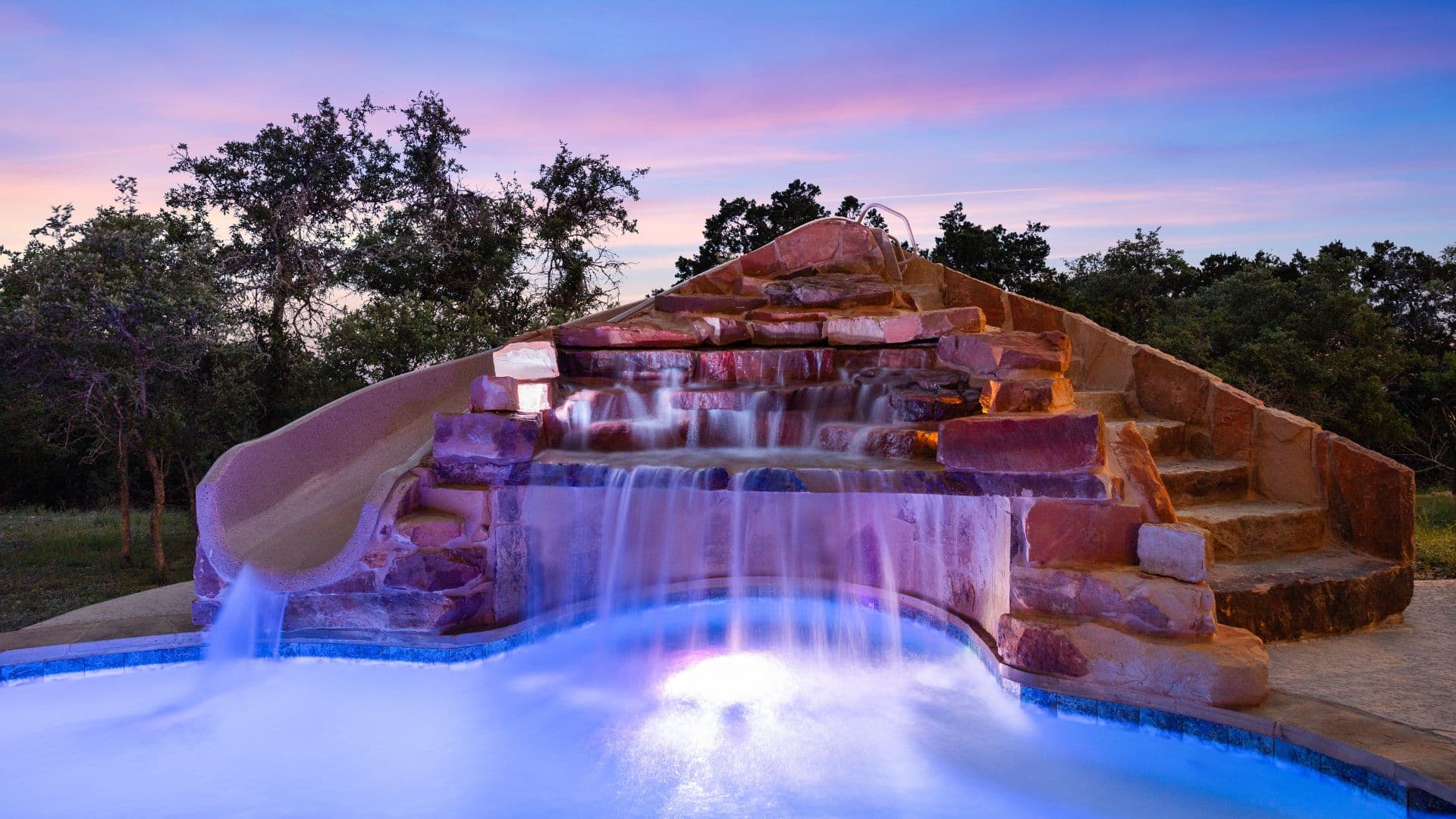 A custom backyard pool and outdoor living space built by Texas Pools & Patios